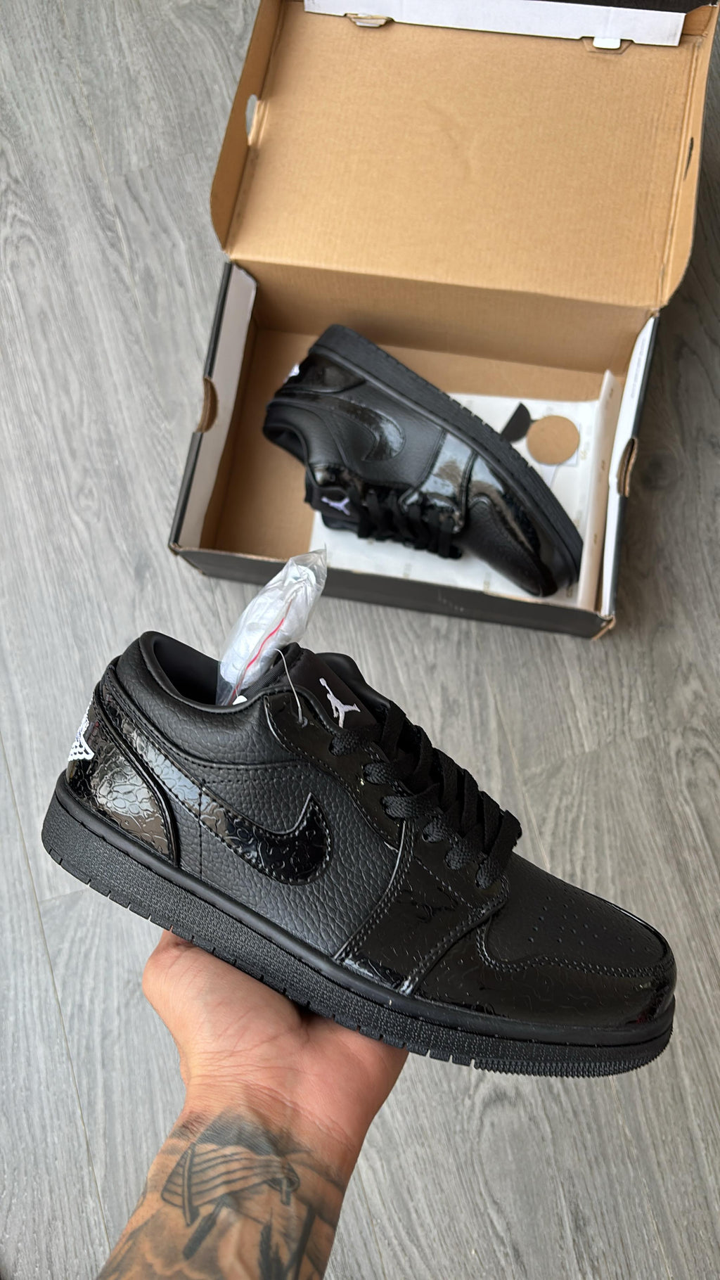 Air Jordan 1 Low Blackout – Triple Black Graphic Swoosh